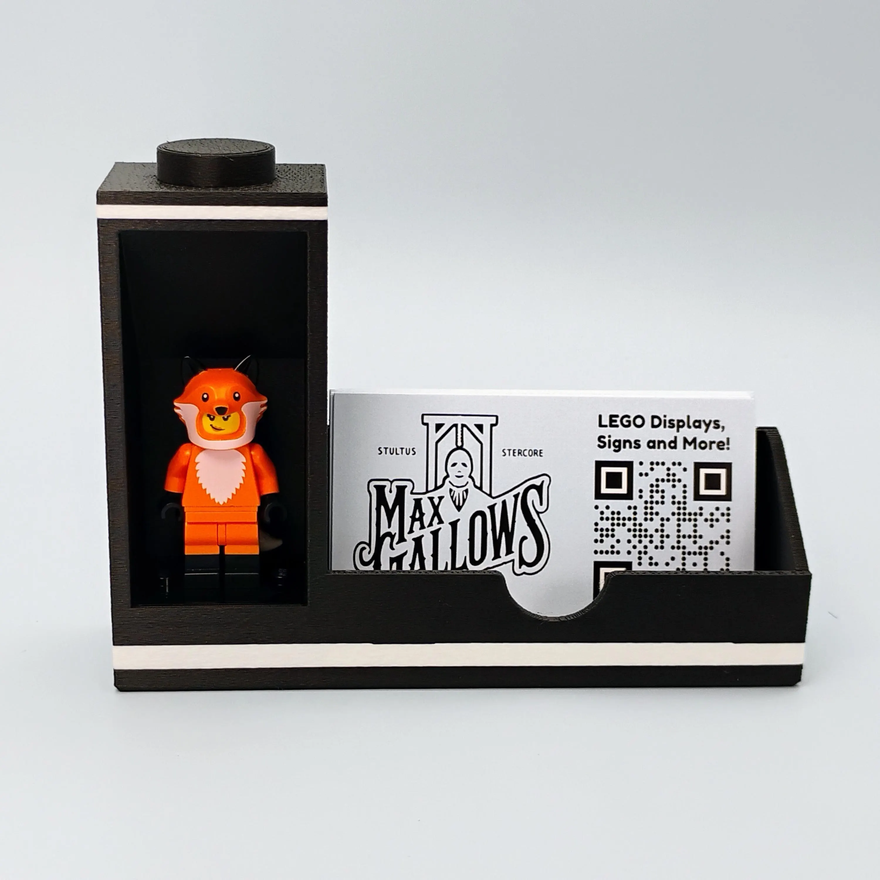 Single-sided LEGO® minifigure bookend display card holder in matte white, featuring one figure beside a business card for a clean, minimalist setup.
